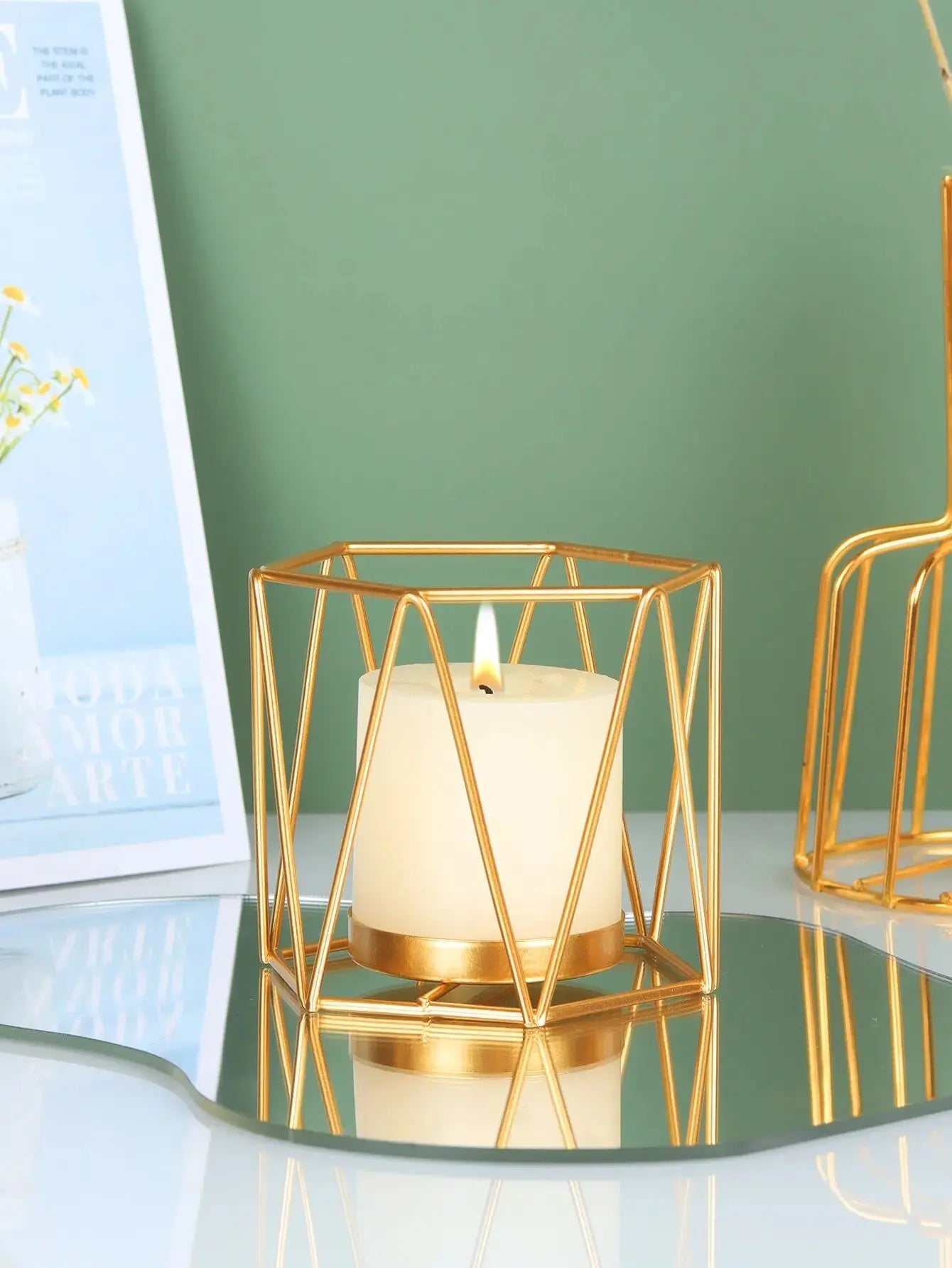 Nordic Gold Iron Candlestick used as a centerpiece in a model room for stylish home decor.